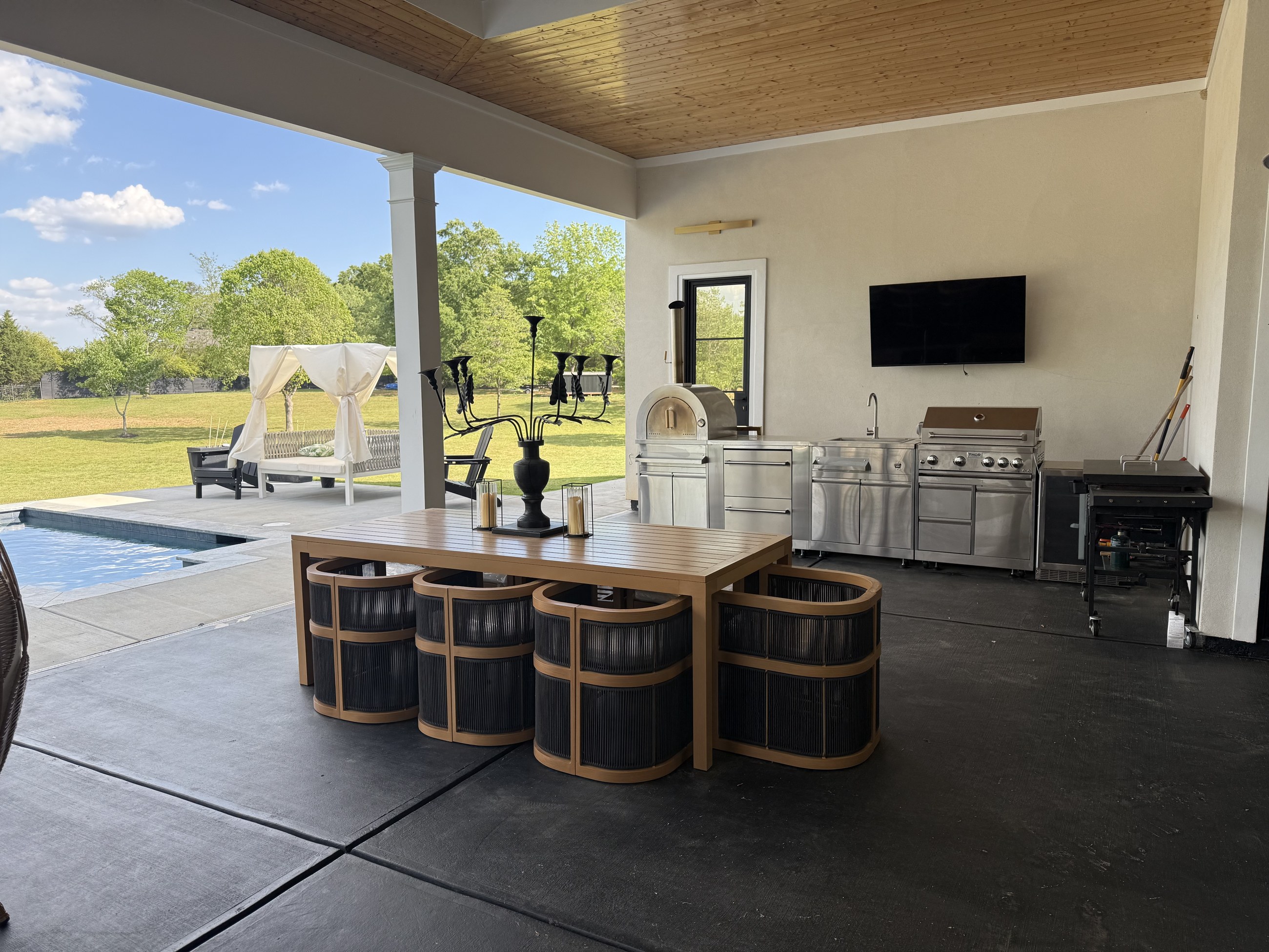 The covered veranda and outdoor kitchen